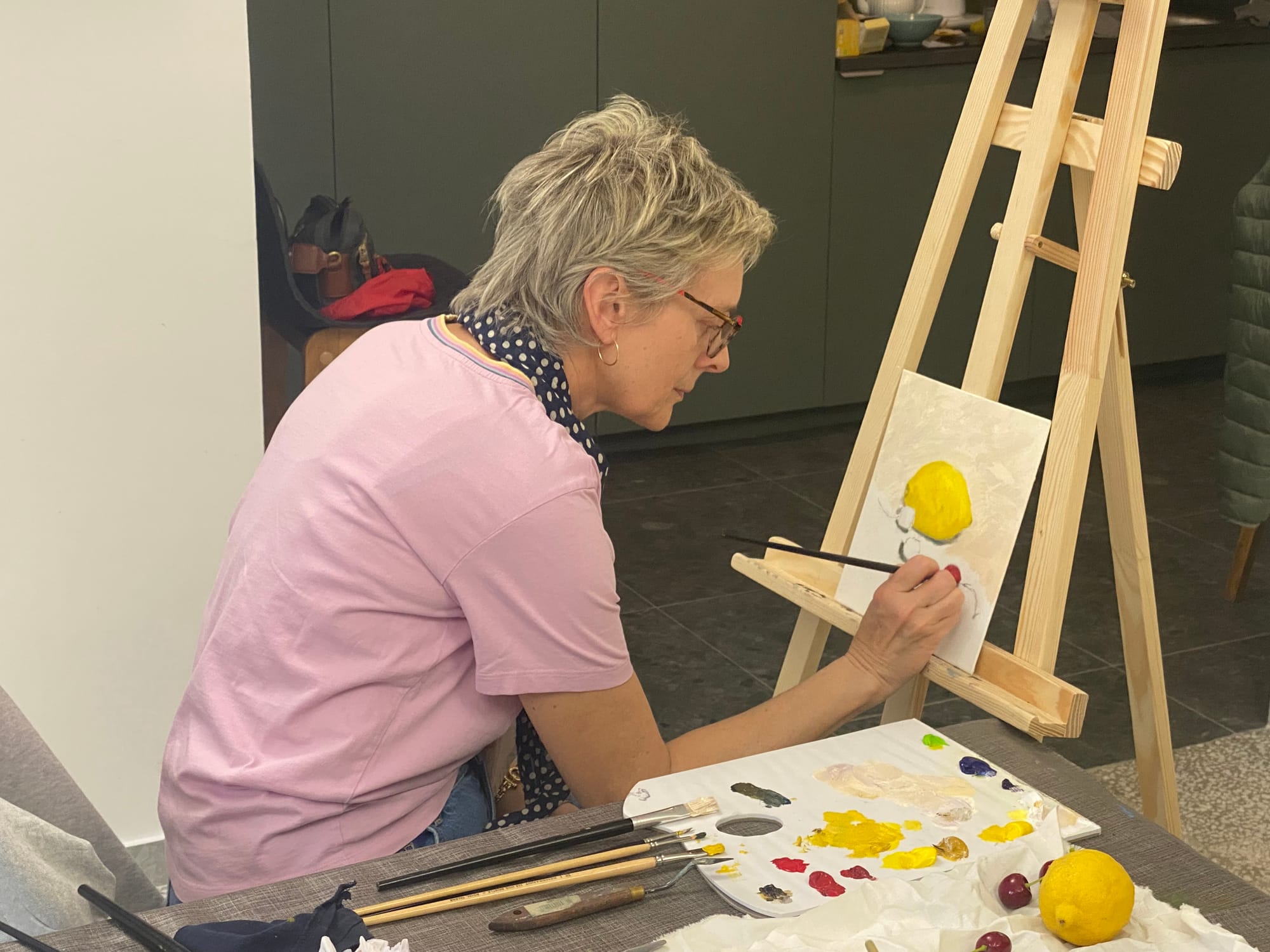 Course participant painting in the studio